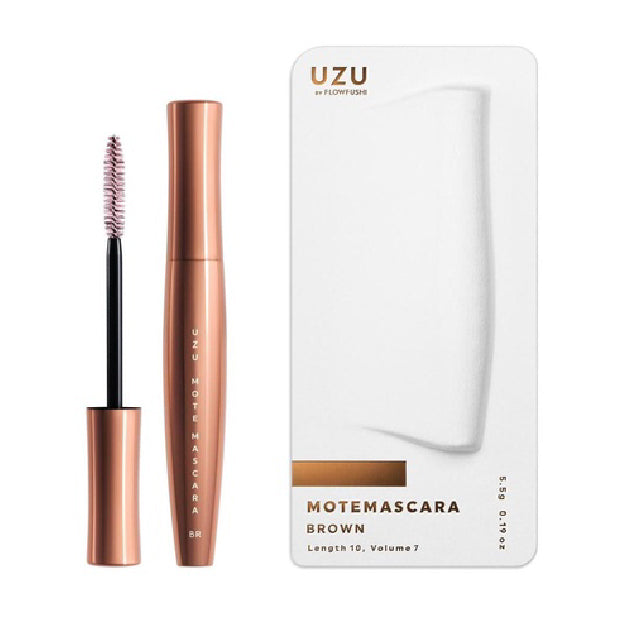 Mascara with rose gold casing and white packaging on a white background